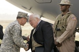 US vice-president Dick Cheney is greeted by General David Petraeus at Baghdad airport