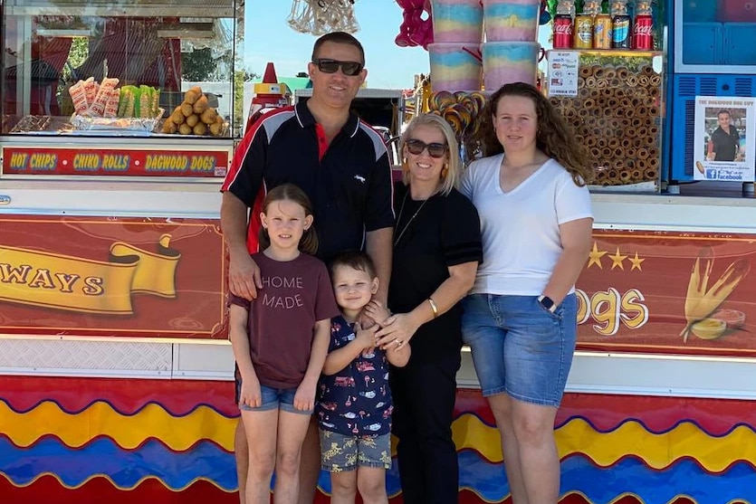 Jesse McDonald with his wife and children out front of his Dagwood Dog van