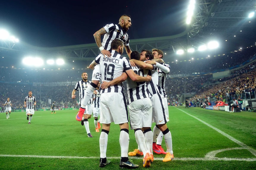 Juventus celebrates Carlos Tevez's goal against Real Madrid