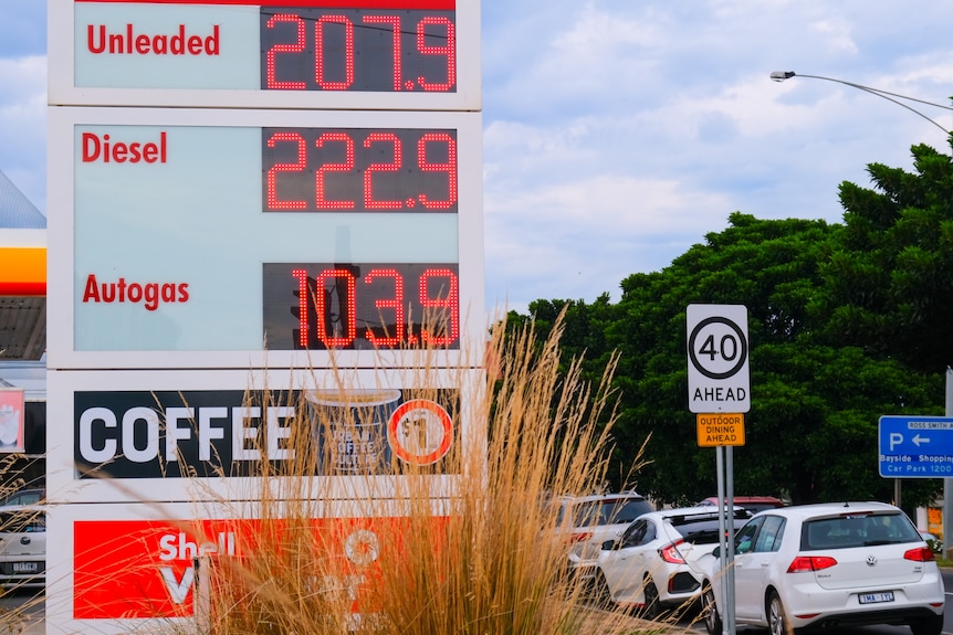 A sign shows petrol prices are over 200c a litre for unleaded and diesel.