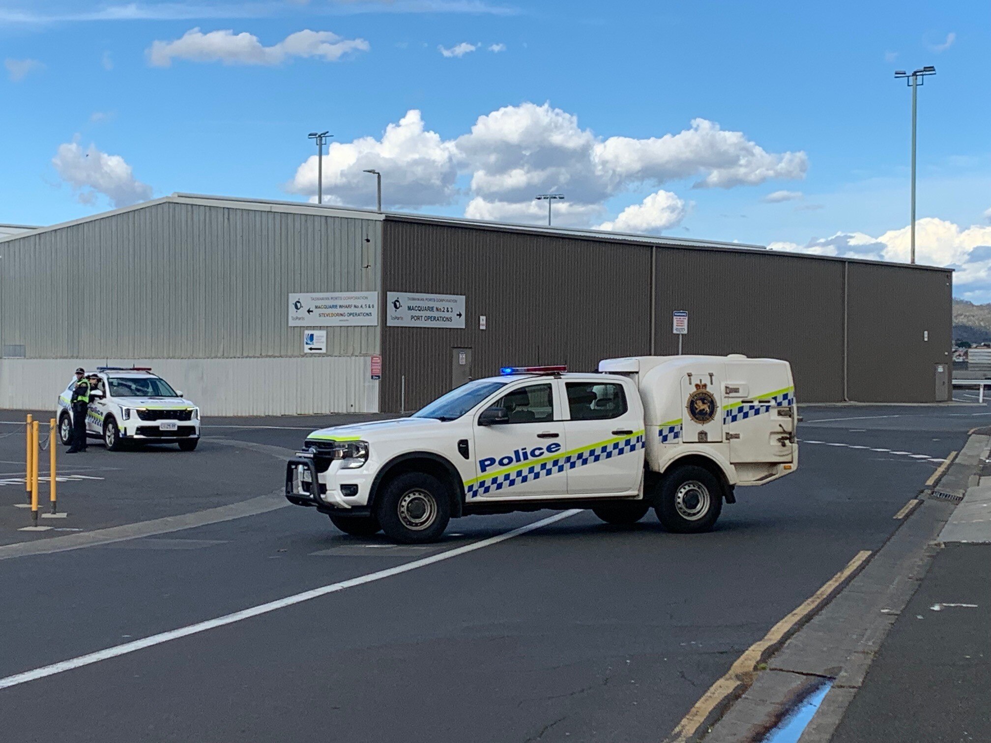 Tasmania Police cars at roadblock.