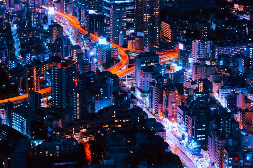 A long-exposure photo of Tokyo at night at a height