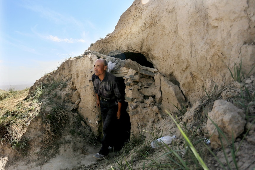 Zhu Keming outside the cave he used to save athletes