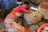 An Indian vendor rests during a heatwave