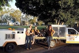 Kellianne Merrick, Rasheeda Layton and Susan Consedine with the CQ Pet Rescue ute and trailer and several dogs