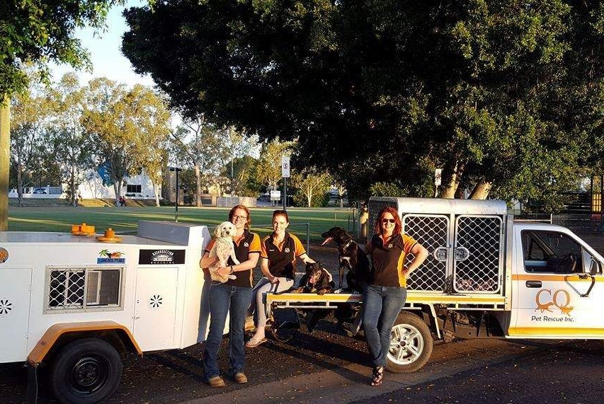 Kellianne Merrick, Rasheeda Layton and Susan Consedine with the CQ Pet Rescue ute and trailer and several dogs