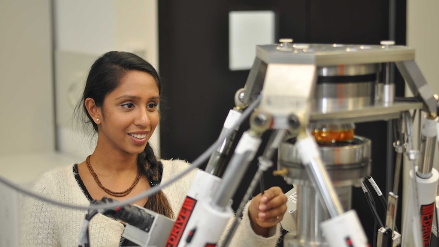 PhD candidate Dhara Amin with Flinders University robot.
