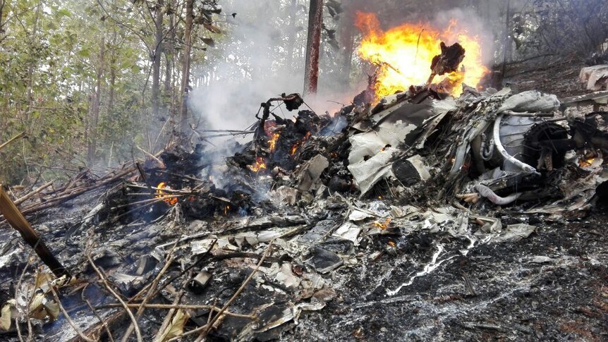 The site of a plane crash in Costa Rica, Sunday, Dec. 31, 2017