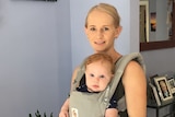 Kirsty McDonald with son Leni in a baby carrier