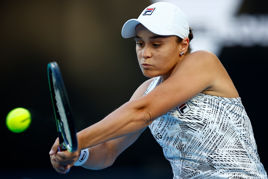 Ash Barty plays a double-fisted backhand at the Australian Open.