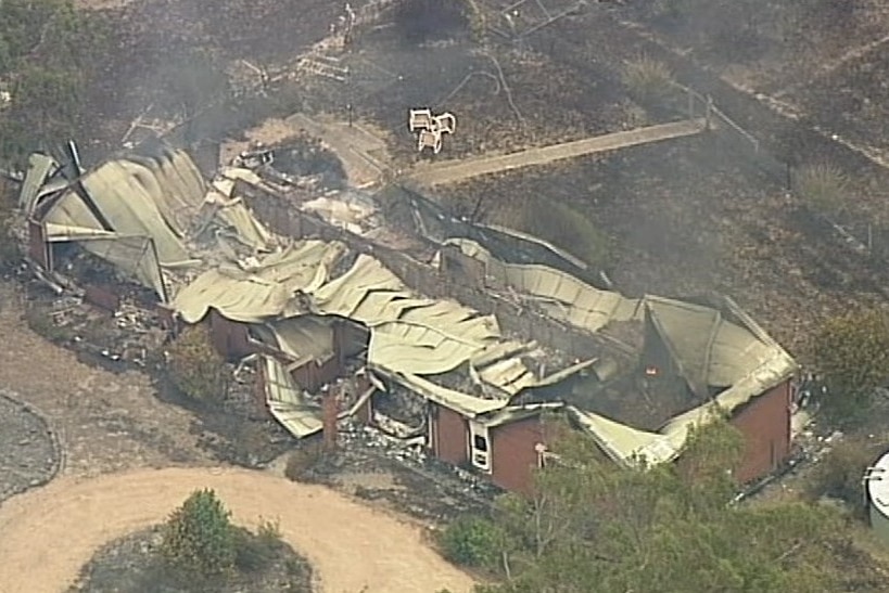 An aerial view of a house destroyed by fire near Clifton Creek and Sarsfield, Victoria.
