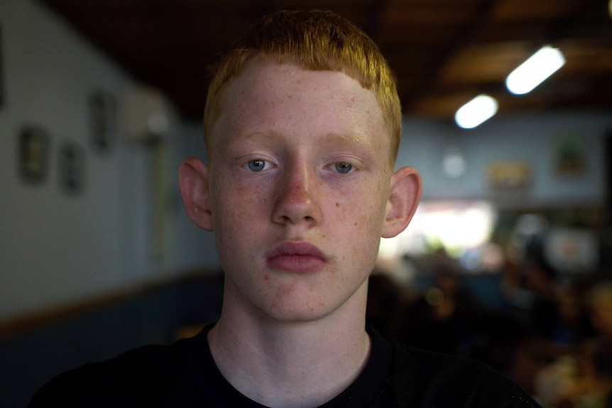 Boy with orange hair. 