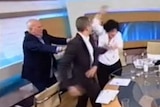 Golden Dawn spokesman Ilias Kasidiaris slaps a female politician on Greek TV