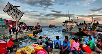 Solomon Islanders wait at the Wate Jetty.