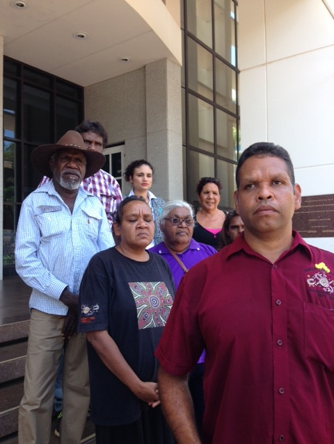 Walter Shaw and Robert Hoosan stand with others including Labor's Lauren Moss and Independent Alison Anderson at NT Parliament.