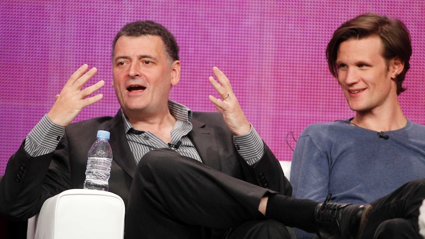 Steven Moffat and Matt Smith sitting together on a couch.