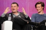 Steven Moffat and Matt Smith sitting together on a couch.