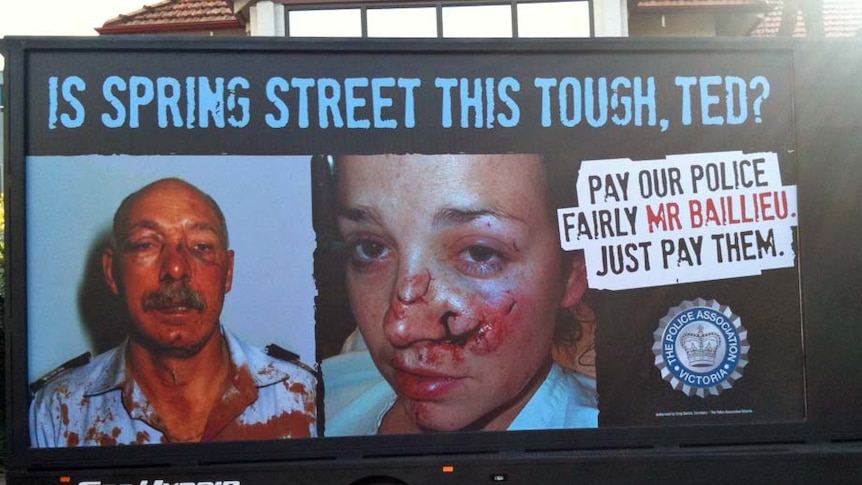 The ads depict police officers who have been bashed.