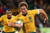 Michael Hooper makes a break against Argentina