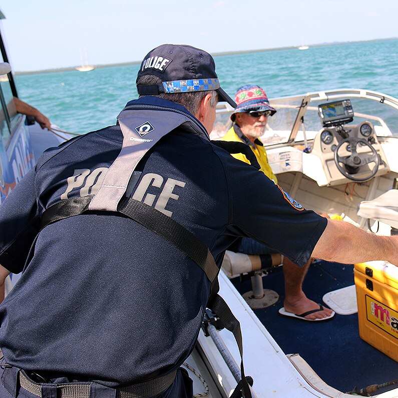 Water police in Darwin check a boat in Darwin.