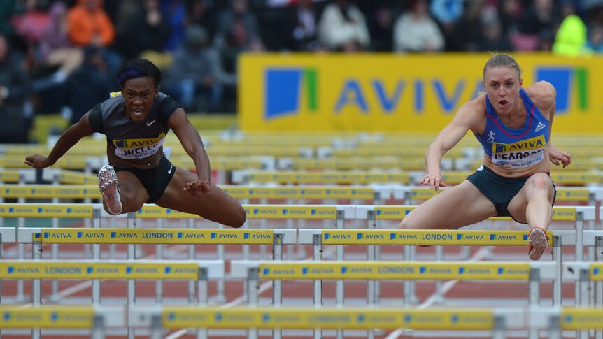 Shock loss ... Sally Pearson (R) clears a hurdle alongside Kellie Wells