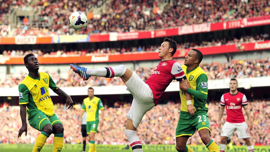 Mesut Ozil scores against Norwich City with overhead