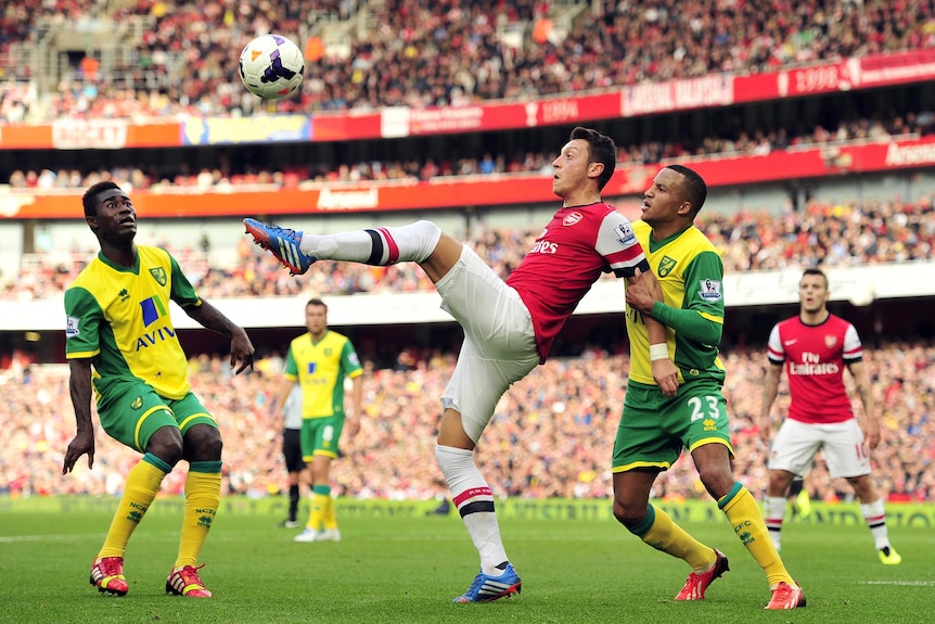 Mesut Ozil scores against Norwich City with overhead