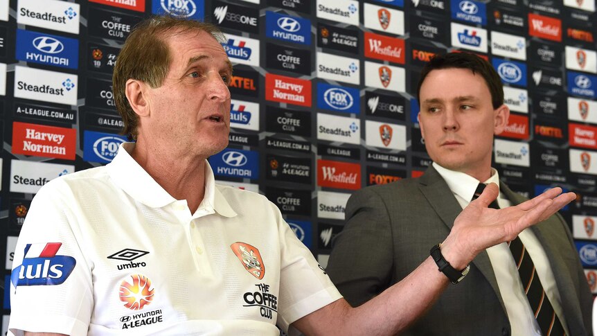 Brisbane Roar interim coach Frans Thijssen and managing director Sean Dobson at press conference.