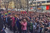 Everyone at the marriage equality rally in Adelaide makes a heart sign, July 25 2015.