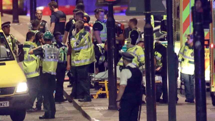 Emergency personnel tend to wounded on London Bridge.