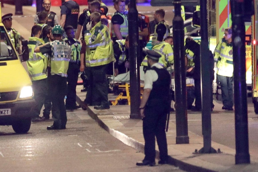 Emergency personnel tend to wounded on London Bridge.