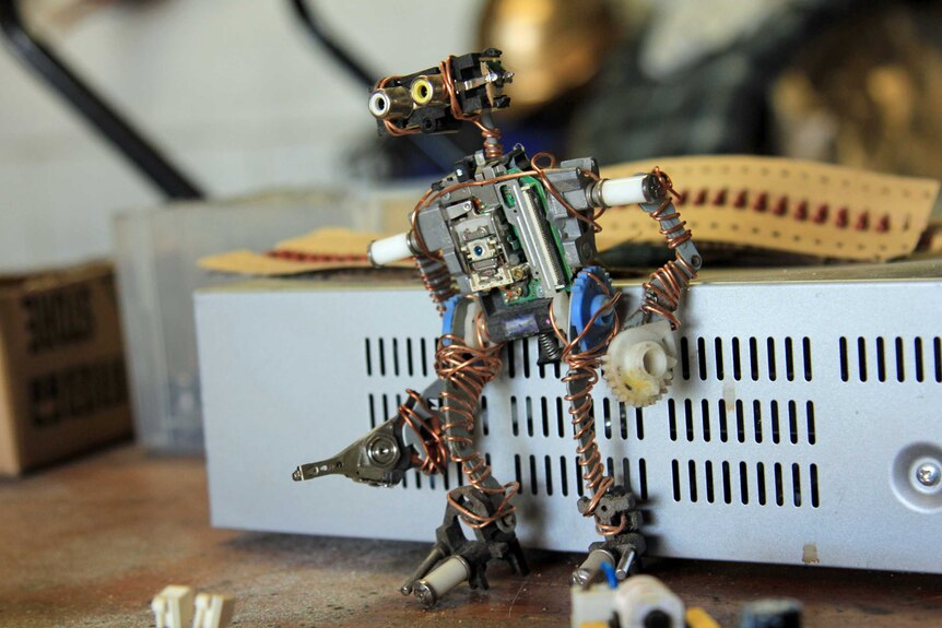 A robot sculpture made of old electronics