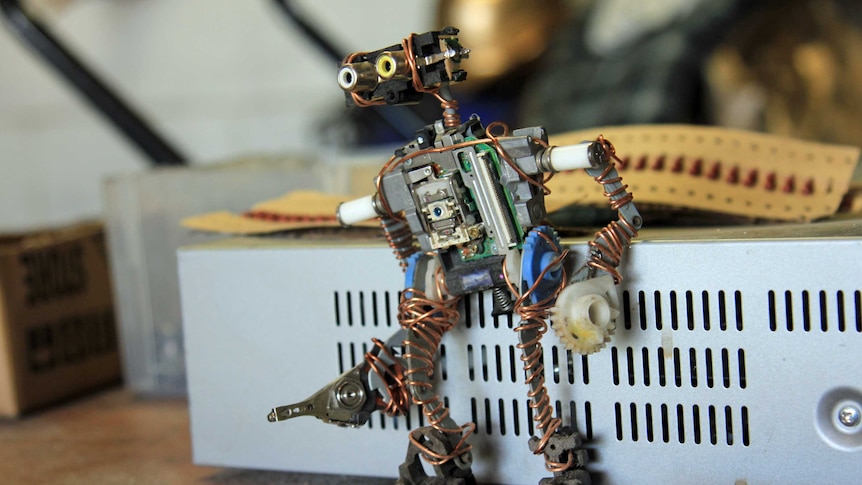 A robot sculpture made of old electronics