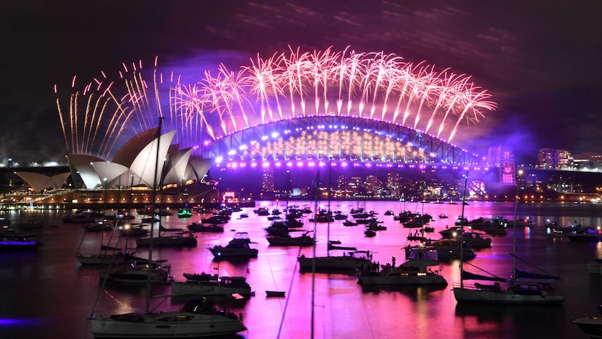 The midnight fireworks light up Sydney Harbour and the Sydney Harbour Bridge during New Year’s Eve celebrations.
