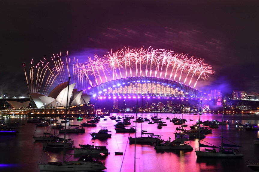 The midnight fireworks light up Sydney Harbour and the Sydney Harbour Bridge during New Year’s Eve celebrations.