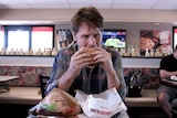 Craig Reucassel eats an Impossible Whopper at Burger King in St Louis, United States.