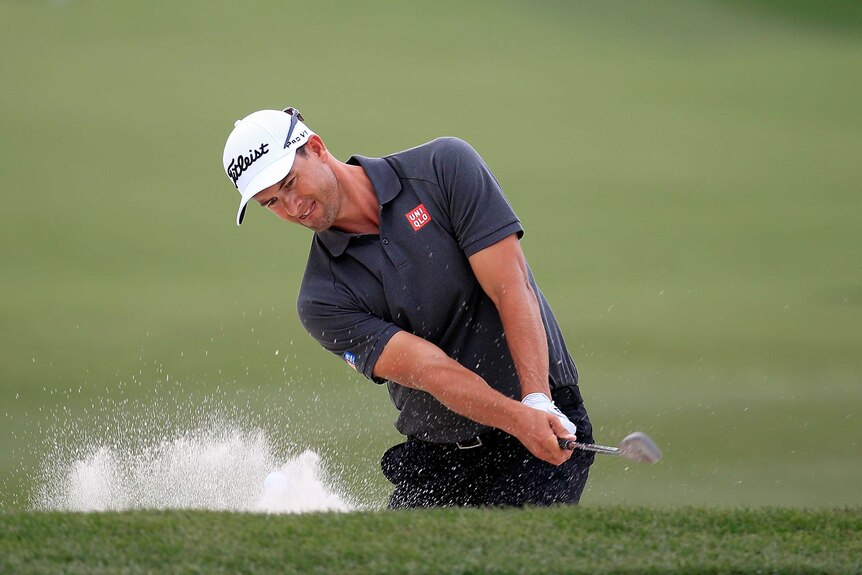 Adam Scott chips out of the bunker at Arnold Palmer Invitational