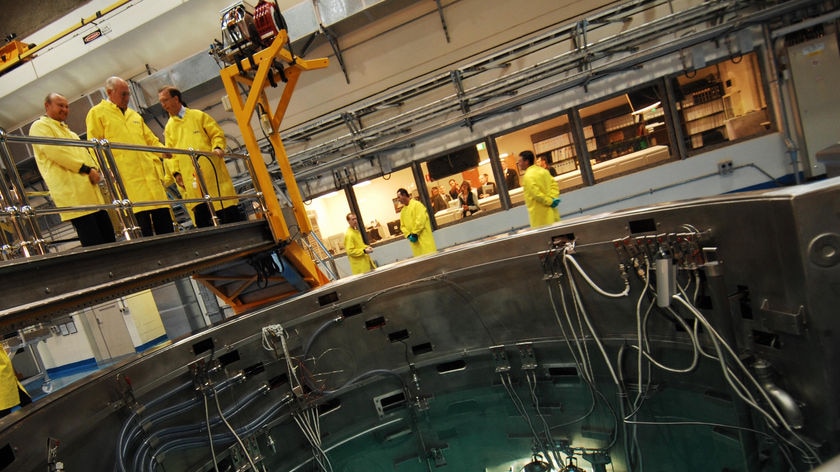 Nuclear plans: Prime Minister John Howard (centre on bridge) looks into the reactor at Lucas Heights earlier this year