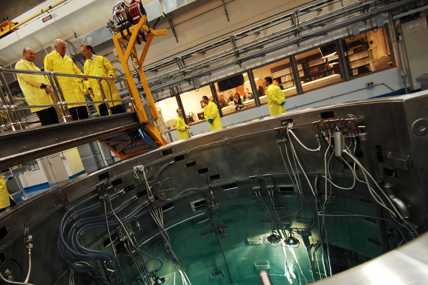 Prime Minister John Howard (centre on bridge) looks into the new Opal nuclear reactor.