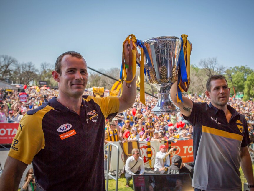 Captains Luke Hodge and Shannon Hurn with the 2015 AFL cup.