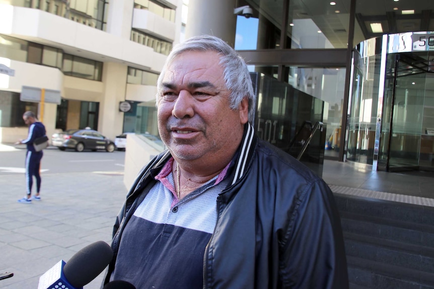Rob Nadalini speaks to a reporter outside a Perth court.