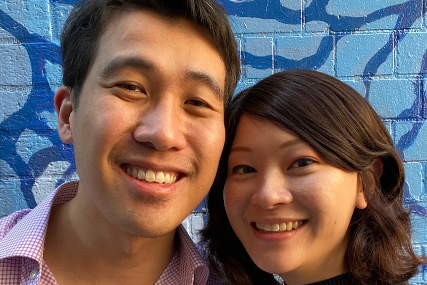 Michelle Law and her partner Dave stand cheek to cheek, smiling for a selfie.