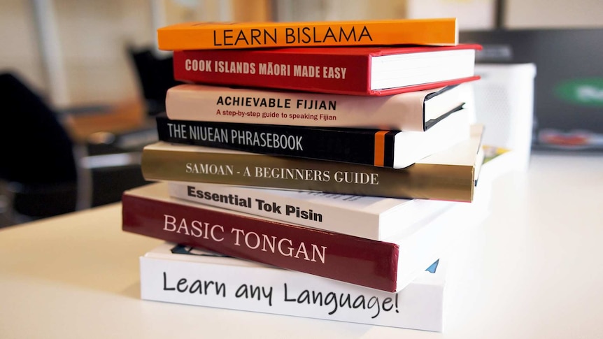 A digitally-altered image showing a stack of textbooks for learners of seven different Pacific Island languages.