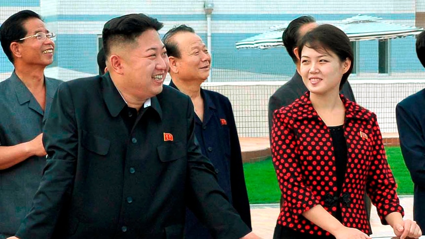 Kim Jong-un alongside a woman Korean TV identified as his wife Ri Sol-ju at the Rungna People's Pleasure Ground.