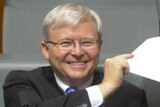Labor backbencher Kevin Rudd smiles during question time.