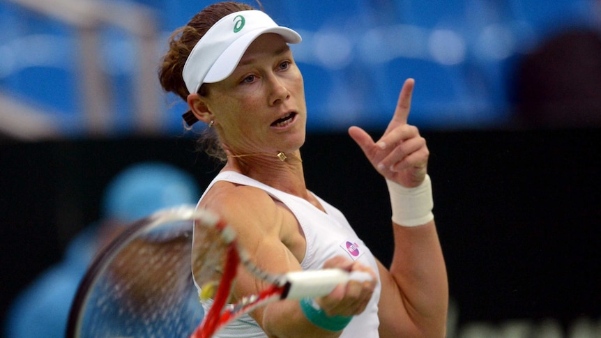 Samantha Stosur in action against Svetlana Kuznetsova