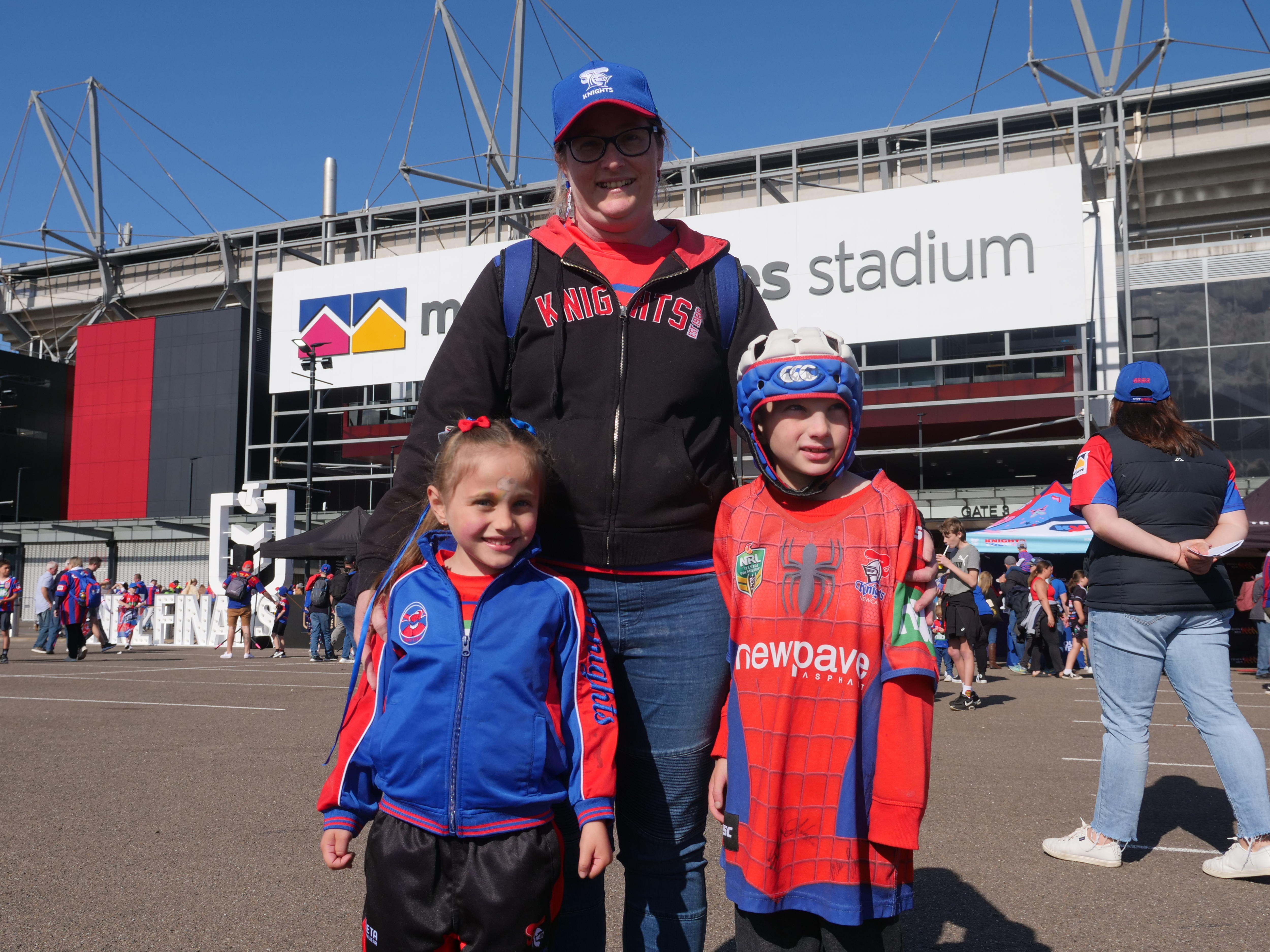 A mother and her two kids in knights gear 