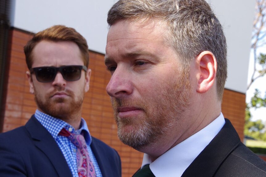 Head shot of WA Nationals Leader Brendon Grylls with another man in the background.