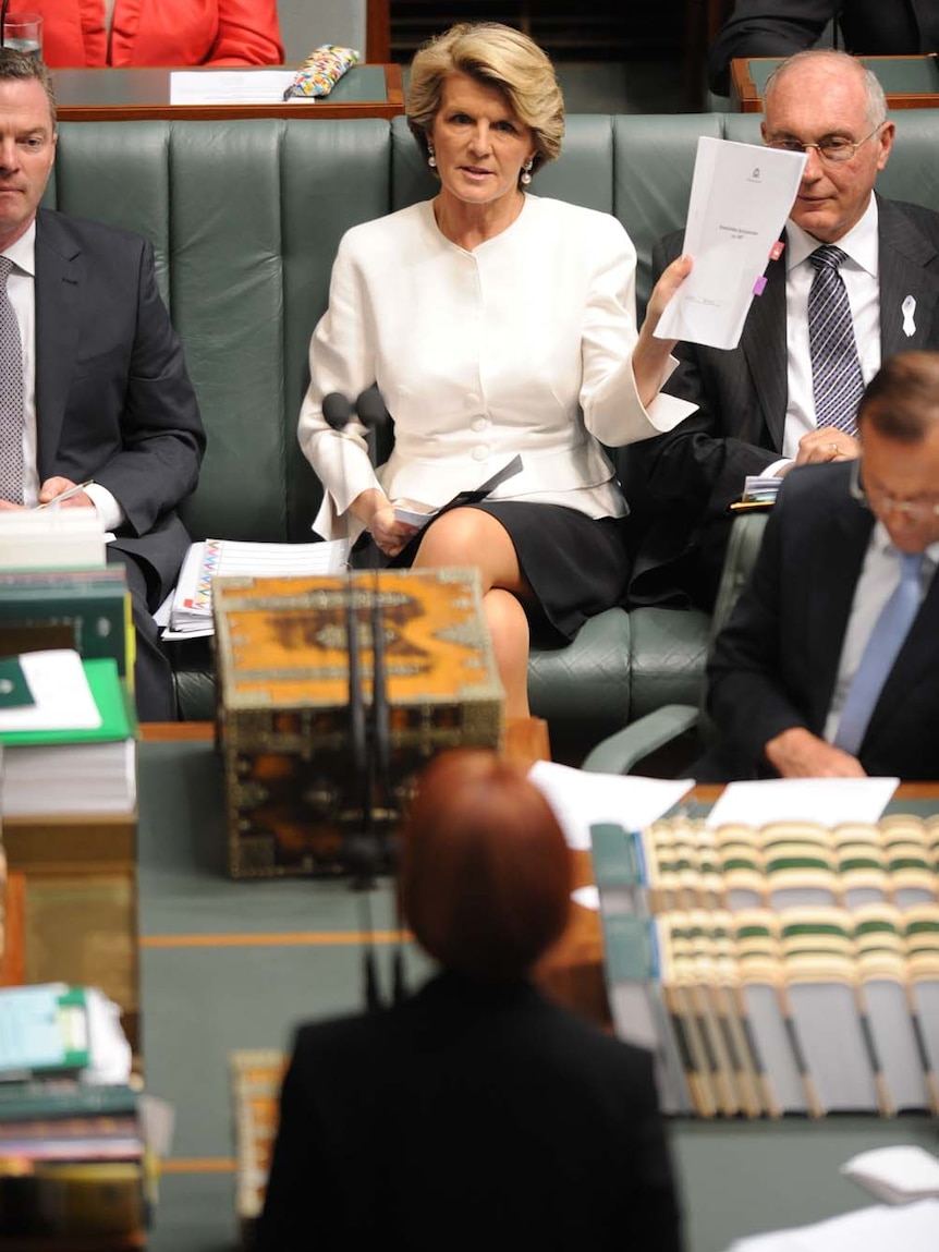 Julie Bishop waves document at Julia Gillard