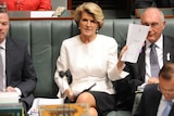 Julie Bishop waves document at Julia Gillard
